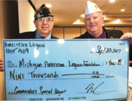 American Legion Post 409 Commander David Babbage with $9000 donation to support Michigan Veterans