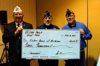 David Babbage, Post 409 Commander, presents a check for $10,000 to help fund building a Fisher House near the Ann Arbor VA Medical Center